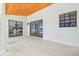 Covered back porch with sliding glass doors leading into the bedroom at 3205 Pleasant Lake Dr, Tampa, FL 33618