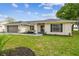 Beautiful single-story home with updated landscaping, new roof, and lake view at 3205 Pleasant Lake Dr, Tampa, FL 33618