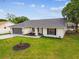 Charming home with landscaped front yard, freshly painted exterior, and two-car garage at 3205 Pleasant Lake Dr, Tampa, FL 33618