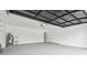 Clean garage featuring ample space, overhead lighting, and a utility sink for added convenience at 3205 Pleasant Lake Dr, Tampa, FL 33618