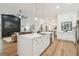 Spacious kitchen island with stainless steel appliances opens to the living room at 3205 Pleasant Lake Dr, Tampa, FL 33618