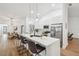 Modern kitchen with island seating area view into dining area at 3205 Pleasant Lake Dr, Tampa, FL 33618