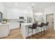 Bright and airy kitchen with island seating and stainless steel appliances at 3205 Pleasant Lake Dr, Tampa, FL 33618