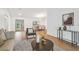 Open-concept living space showcasing wood floors and abundant natural light at 3205 Pleasant Lake Dr, Tampa, FL 33618