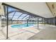 Screened pool with lake view at 3205 Pleasant Lake Dr, Tampa, FL 33618