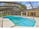 Private screened pool area with a view of the house; perfect for entertaining and enjoying the outdoors at 3205 Pleasant Lake Dr, Tampa, FL 33618