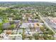 Birds-eye view of a residential community, highlighting apartment buildings, and proximity to local businesses and roadways at 361 Colonial Ct, Dunedin, FL 34698