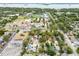 An aerial shot showcases a community near a baseball stadium with easy access to local roads and various amenities at 361 Colonial Ct, Dunedin, FL 34698