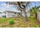 The home has a backyard with patio area and storage at 361 Colonial Ct, Dunedin, FL 34698