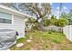 The backyard features a shed, plants, and a patio area at 361 Colonial Ct, Dunedin, FL 34698