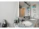 Bathroom featuring double sinks, granite countertops and a well-lit vanity area at 361 Colonial Ct, Dunedin, FL 34698