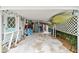 A view of the carport with room for storage and activities at 361 Colonial Ct, Dunedin, FL 34698