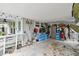 A wide angle view of the open carport attached to the house at 361 Colonial Ct, Dunedin, FL 34698