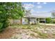 Quaint single-story home featuring a charming, partially-covered front porch at 361 Colonial Ct, Dunedin, FL 34698