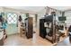 A versatile room featuring a charming, light blue door, natural lighting, and decorative shelving for storage and display at 361 Colonial Ct, Dunedin, FL 34698
