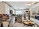 Bright kitchen featuring granite countertops, stainless steel appliances, and ample cabinet space at 361 Colonial Ct, Dunedin, FL 34698