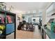 Open-concept living area with abundant natural light and tile flooring at 361 Colonial Ct, Dunedin, FL 34698