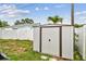 The backyard features a metal shed for storage at 361 Colonial Ct, Dunedin, FL 34698
