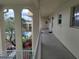 Exterior hallway overlooking the community pool and lush landscaping at 3850 13Th N Ave # 311, St Petersburg, FL 33713