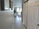 Entrance hallway featuring tile flooring and a view into the living area at 3850 13Th N Ave # 311, St Petersburg, FL 33713