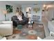 Cozy living room featuring tile flooring, stylish furnishings, and ample natural light at 3850 13Th N Ave # 311, St Petersburg, FL 33713
