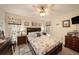 Nicely decorated bedroom with a queen-sized bed, nautical decor, and plenty of natural light at 4326 Great Lakes N Dr, Clearwater, FL 33762