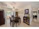 Inviting dining area featuring tile floors, a ceiling fan, and sliding glass doors to outdoor living at 4326 Great Lakes N Dr, Clearwater, FL 33762