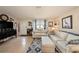 Inviting living room showcasing tile floors, a comfortable seating arrangement, and an open, airy feel at 4326 Great Lakes N Dr, Clearwater, FL 33762