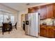 Bright dining area with stainless steel refrigerator and lots of cabinet space at 4968 Anniston Cir, Tampa, FL 33647