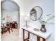 Stylish entryway with a marble table and view of the dining area at 4968 Anniston Cir, Tampa, FL 33647