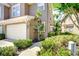Charming townhome featuring a one car garage and lush landscaping at 4968 Anniston Cir, Tampa, FL 33647