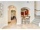 Open hallway with views into the kitchen and dining area at 4968 Anniston Cir, Tampa, FL 33647