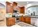 Stylish kitchen with stainless steel appliances and granite countertops at 4968 Anniston Cir, Tampa, FL 33647