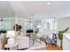 Open living room with hardwood floors and abundant natural light from large windows at 4968 Anniston Cir, Tampa, FL 33647