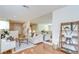 Bright living room featuring hardwood floors, modern decor, and a large mirror wall at 4968 Anniston Cir, Tampa, FL 33647