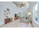 Inviting living room with high ceilings, lots of light, and comfortable seating at 4968 Anniston Cir, Tampa, FL 33647