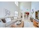 Open-concept living room with tall ceilings and access to kitchen area at 4968 Anniston Cir, Tampa, FL 33647