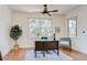 Home office with hardwood floors, a large window, and a ceiling fan at 4968 Anniston Cir, Tampa, FL 33647
