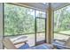 Relaxing screened-in patio with comfortable seating and serene views at 4968 Anniston Cir, Tampa, FL 33647