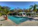 Large community pool with clear water, lounge chairs, and a pergola for shade at 4968 Anniston Cir, Tampa, FL 33647