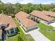 Spacious single-Gathering home boasts a well-manicured lawn, neutral exterior, and convenient attached garage at 521 Bent Oak Ct, Spring Hill, FL 34609