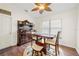 Cozy dining area with hardwood floors, natural light, and stylish furniture at 521 Bent Oak Ct, Spring Hill, FL 34609
