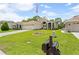Charming home with a well-kept lawn, inviting entrance, and an American flag proudly displayed at 521 Bent Oak Ct, Spring Hill, FL 34609