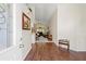 Inviting foyer featuring hardwood flooring, high ceilings, and a view into the living area at 521 Bent Oak Ct, Spring Hill, FL 34609