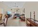 Spacious living room featuring vaulted ceilings, large windows, and comfortable seating arrangement at 521 Bent Oak Ct, Spring Hill, FL 34609