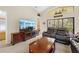 Cozy living room features a large flat screen television and seating area at 521 Bent Oak Ct, Spring Hill, FL 34609
