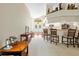 Bright living room with bar stool seating and view of the front entry at 521 Bent Oak Ct, Spring Hill, FL 34609