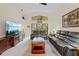 Inviting living room with comfortable leather furniture, vaulted ceilings, and a large television at 521 Bent Oak Ct, Spring Hill, FL 34609