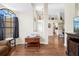 Bright living room with hardwood floors leading to the open-concept kitchen and living spaces at 521 Bent Oak Ct, Spring Hill, FL 34609