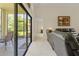 Relaxing living room with sliding doors to the screened-in lanai at 521 Bent Oak Ct, Spring Hill, FL 34609
